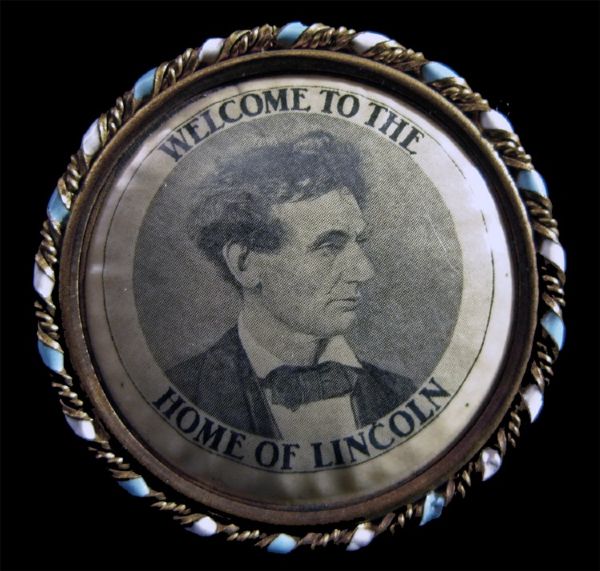 Attractive Pendant Displaying Lincoln’s Beardless “Tousled Hair Pose” On One Side, The State Capitol At Springfield On The Other