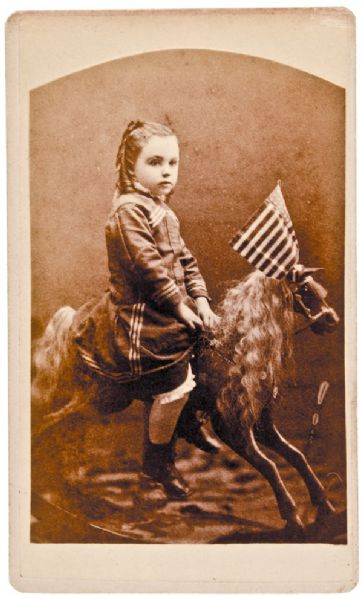Young Girl Riding Her Wooden Hobby Horse with a Vintage American Flag on This Patriotic CDV